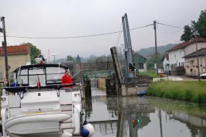 Richard awaits the arrival of barge- note bridge raised and lock ready