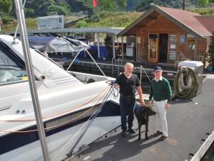 Hafenmaster St Goar and his dog holding up Irish Pen we gave him