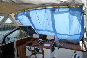 Nuala's idea to keep the sun of the deck- a bed sheet