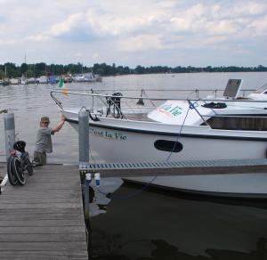 Adrian walking on water as he cleans the boat