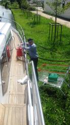 Adrian puts diesel in the boat from cans