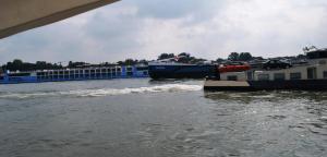 busy Rhine one barge going down stream between two other barges going up and us on the side as well