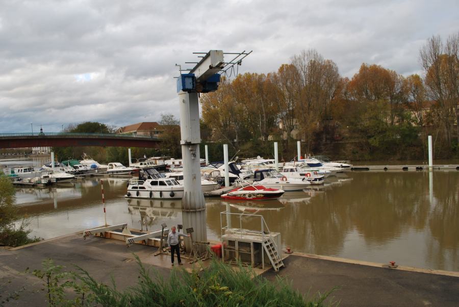 Adrian points out the level the water reached after the water has subsided