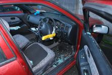 Car with smashed window- glass everywhere