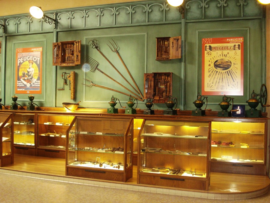 glass cases showing range of products make by Peugeot in the earlier years