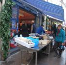 Nuala buys the fish in the market