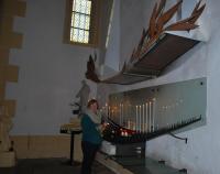Nuala lights a candle in The Basilica at Paray-le-Monial