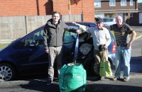 Lewis and Neil help Adrian unload car before it goes to the garage